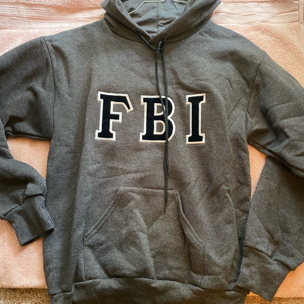 Dark grey FBI sweatshirt.  Medium size.